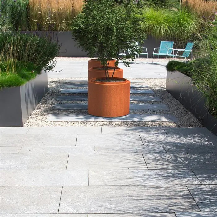 Jardinera redondo de acero Corten de 120 x 60 cm con borde.