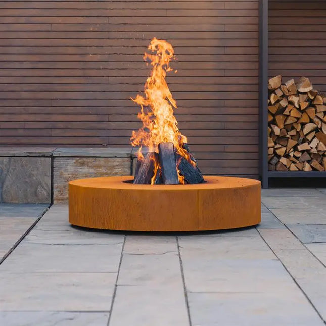 Mesa de fuego redonda de acero Corten de 125 x 28 cm
