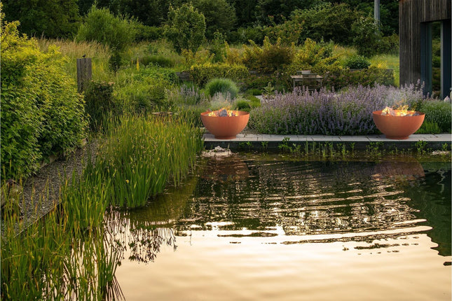 Jardinera redondo de acero Corten de 120 x 61 cm con base.
